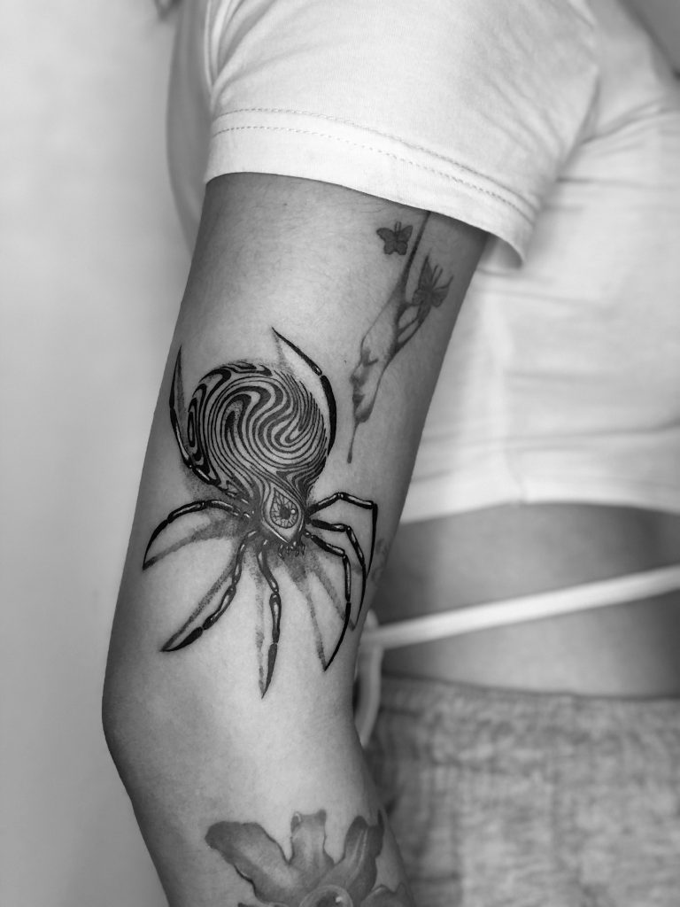 Spider tattoo in Ceby City